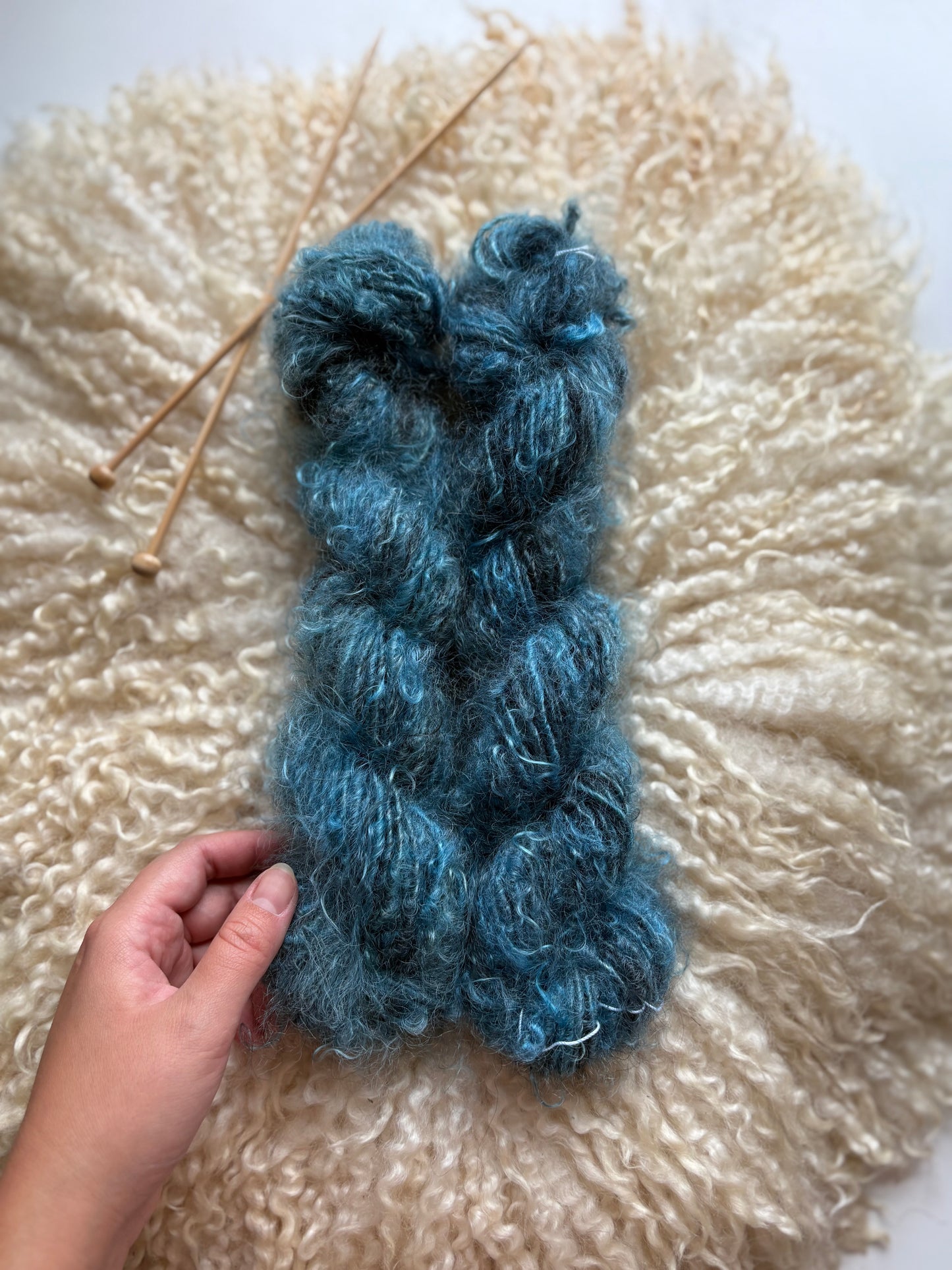 Single ply 100% adult mohair lock spun art yarn. 3.50oz 60 yards dyed from Stormy. Medium Soft.