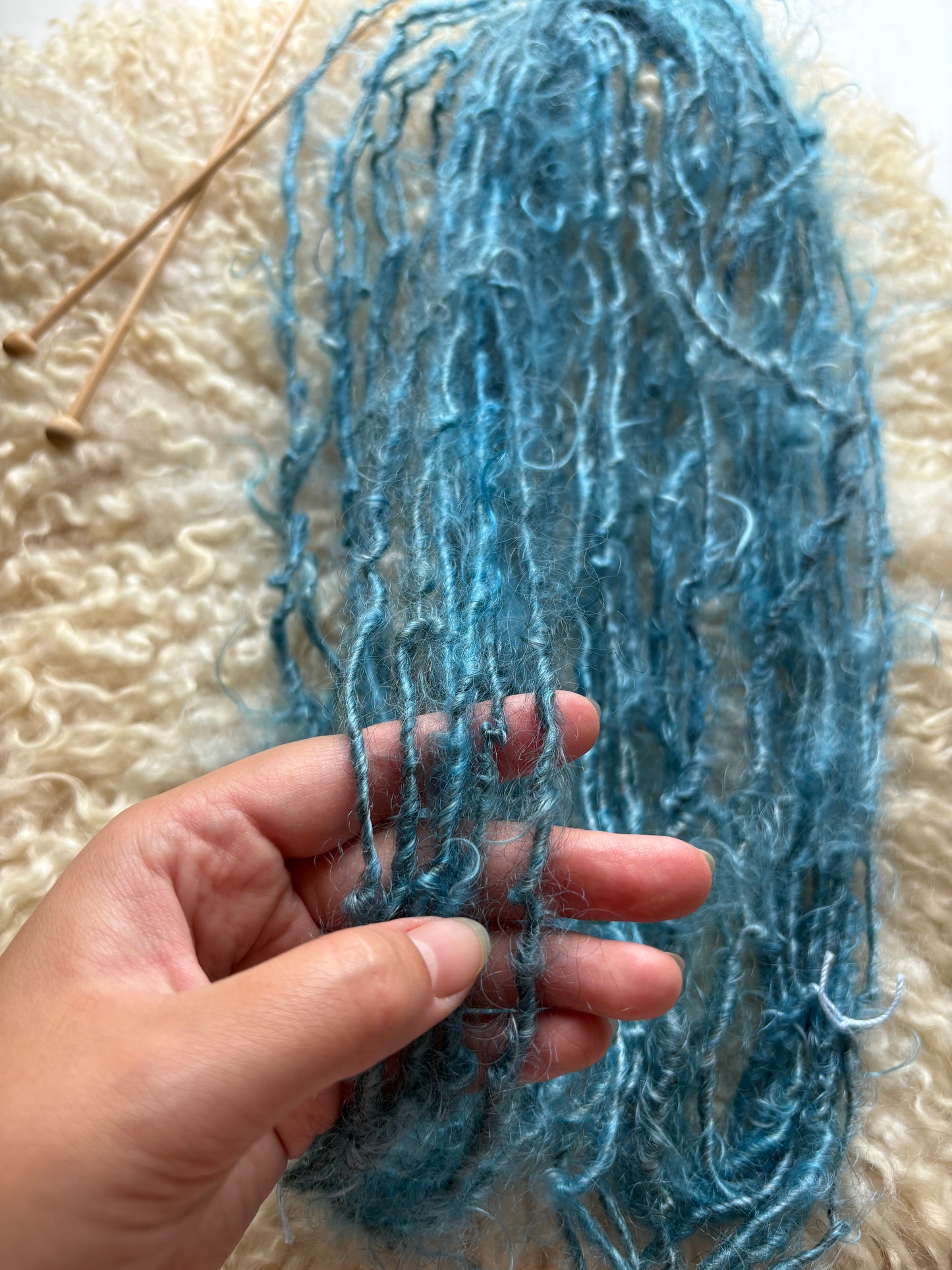 Single ply 100% adult mohair lock spun art yarn. 3.50oz 60 yards dyed from Stormy. Medium Soft.